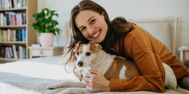 woman with dog who does sweet things every day without her noticing