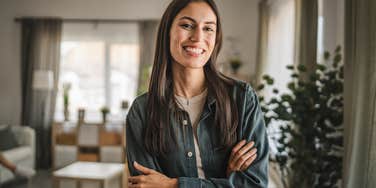 smiling millennial woman acting like shes in charge