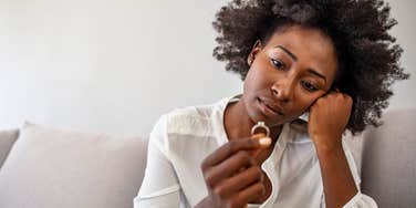 woman who is considering breaking up after a disappointing proposal