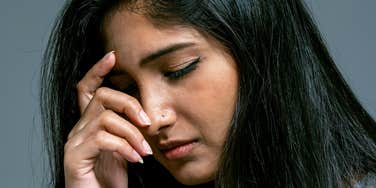 Woman is deeply unhappy.