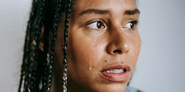 Woman is still carrying trauma.