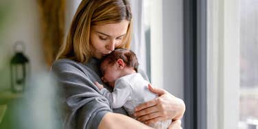 new mom holding newborn baby