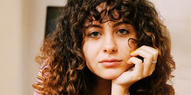 Woman who's using calming rituals.