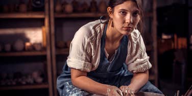 Creative woman doing pottery who came from a broken home