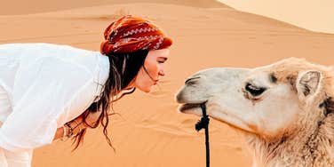 Woman ditching therapy for camel rides to heal from divorce. 