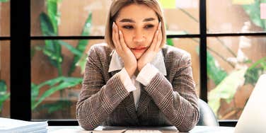 Overwhelmed woman at her dream job. 