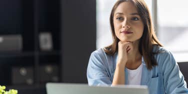 woman using email phrases that hurt chances for promotion