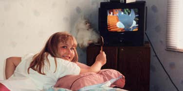 Gen-X watching movies that have aged horribly, in bedroom as a child