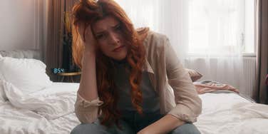 Woman realizing there's one item in her bedroom that's filled with germs