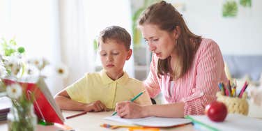 Mom actively doing her child's homework after admitting it to teacher
