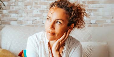 Woman reflecting on year of total emotional reset. 