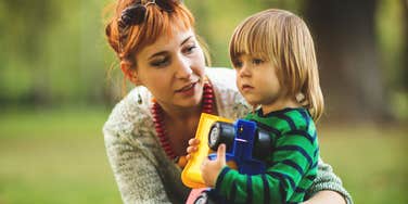 A parent supports their child in a quiet moment reflecting how kids are raised without a victim mentality