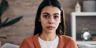 sad anxious woman thinking about her controlling childhood