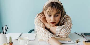 Woman drained by energy vampires at work
