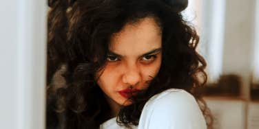 Woman trying to manage anger without hurting the person she loves.
