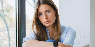 sad pensive woman who was raised without financial stability