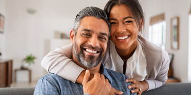 happy couple man making woman feel safe
