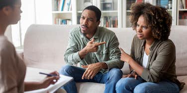 married couple arguing with each other during counseling