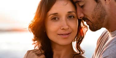 brilliant woman standing next to her man in happy relationship