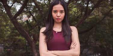young gen z woman looking serious about her expectations