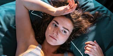 Woman waking up from a dream.