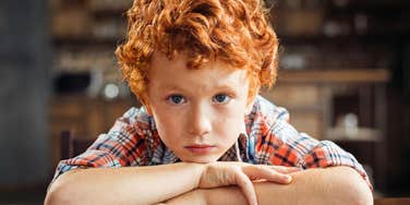 sad kid with broken heart