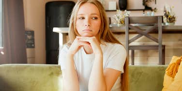 resentful woman thinking on couch