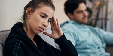 unhappy woman realizing shes not safe in her relationship