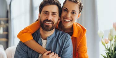 happy loving couple embracing hugging