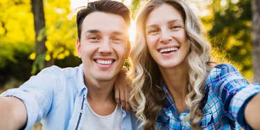 happy man taking selfie with the woman he loves