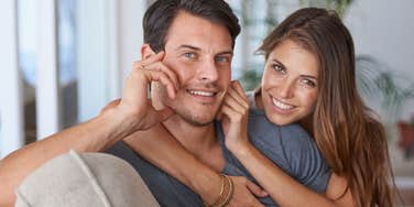 happy unmarried couple smiling