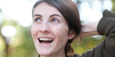 Woman snaps out of bad mood fast.