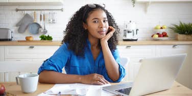 woman with the exact amount of money in a savings account to feel less stressed