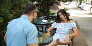 woman getting floodlighted by date