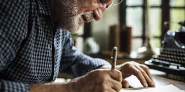 grandfather writing letter in cursive