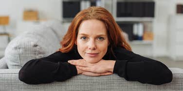 frugal young woman relaxing on the couch