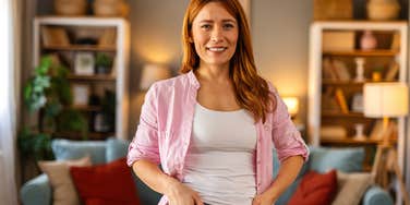 woman standing in her living room with all her decor