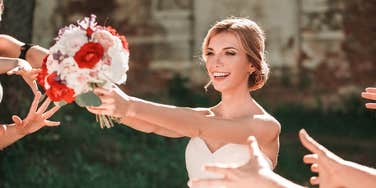 bride preparing to toss the bouquet