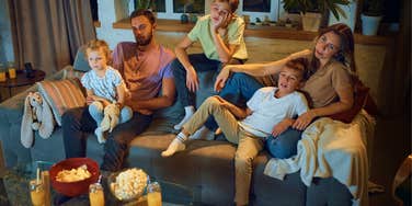 Mom bored during family movie night happy the tradition failed