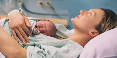 new mom holding newborn baby