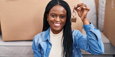 mom holding key to her new house