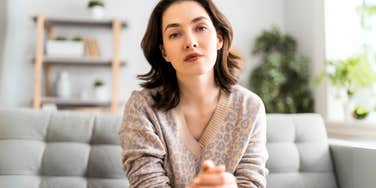 Woman using dangerous words in couples therapy. 