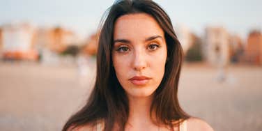 serious woman with long hair thinking about life lessons