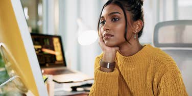 frustrated tired woman after being surrounded by idiots at work
