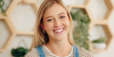 southern young woman in overalls smiling