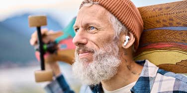 man with skateboard who was raised with old-school values
