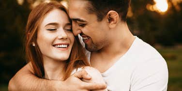 man hugging woman he loves deeply