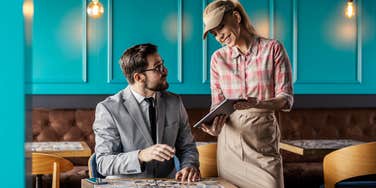 Server accepting huge tip from creepy customer
