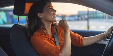 Woman singing in her car making her life better