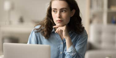 Gen Z woman who is spending a lot of money looking for a job according to survey